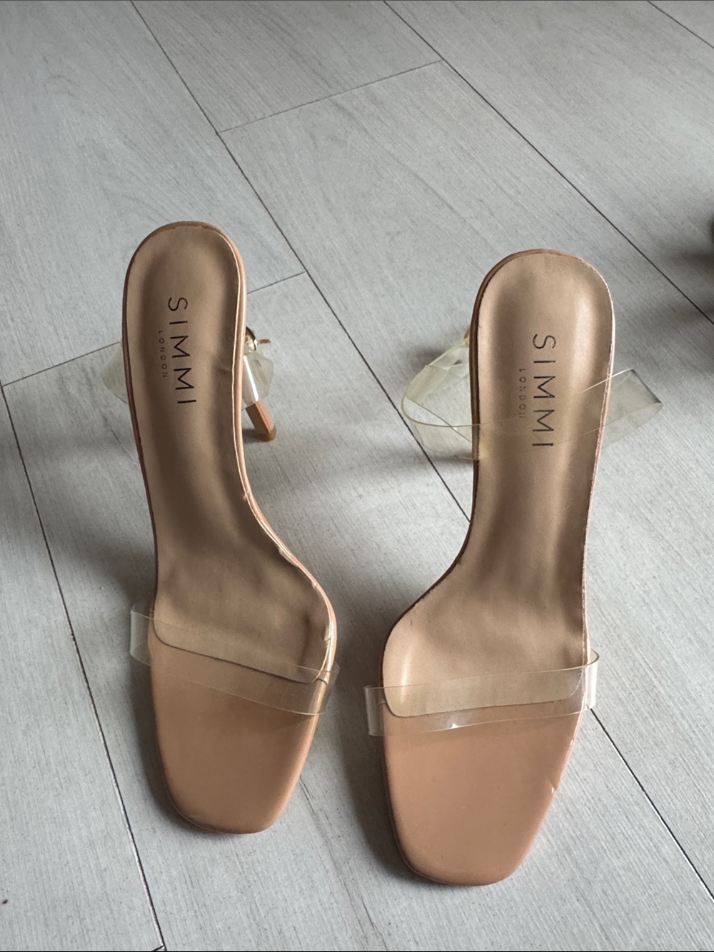 Sleek Nude Stiletto Heels with Clear Ankle Straps